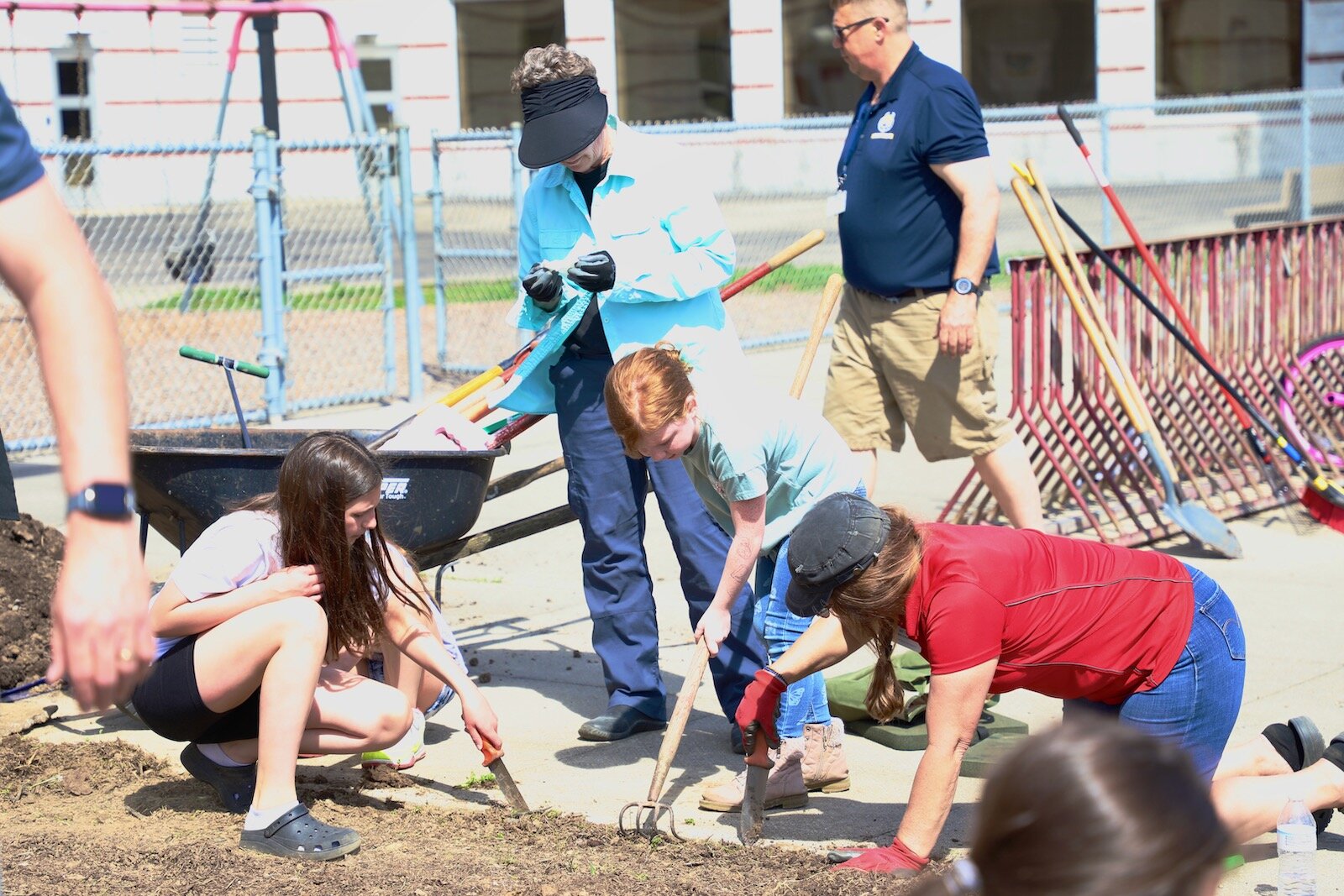 Snyder Park Elementary students work in the community garden that creates an appealing entrance to the school.