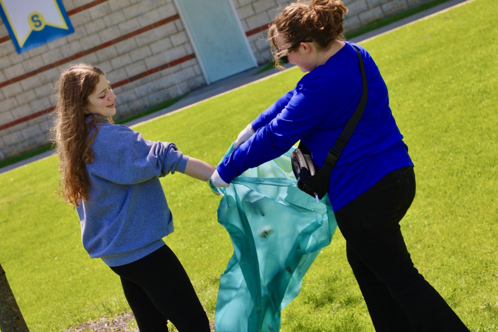 Springfield High School National Honor Society members participated in a beautification effort as their Earth Day observance.