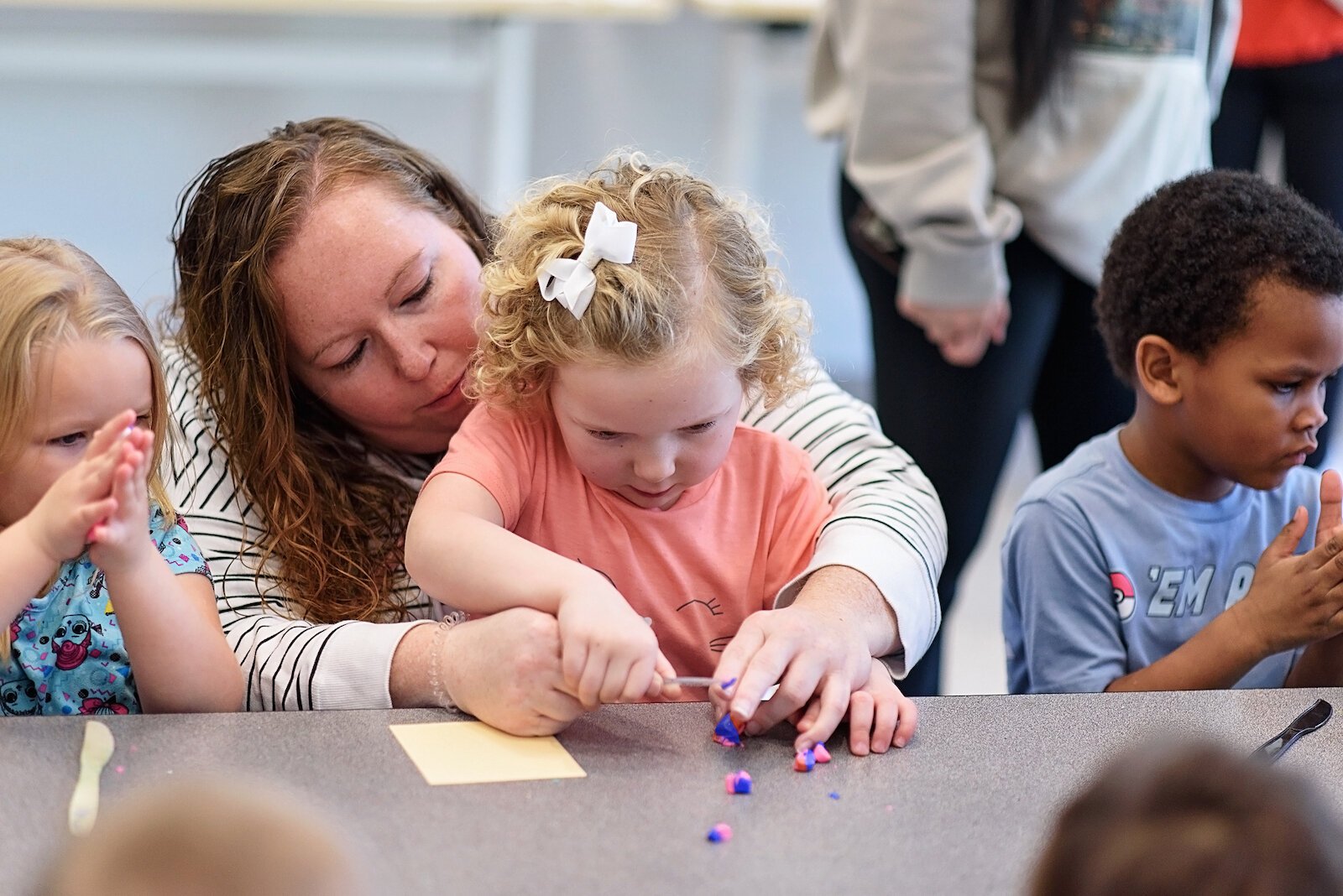 Jessica Raab helps her daughter Julia create a dragon.