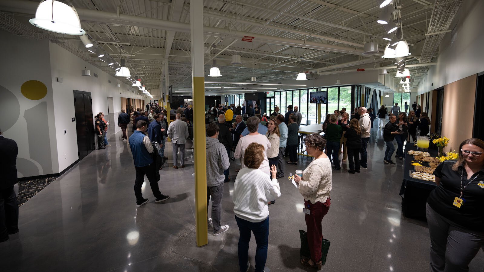 Attendees at the ceremony explore the new Upper Academy in Springfield. 