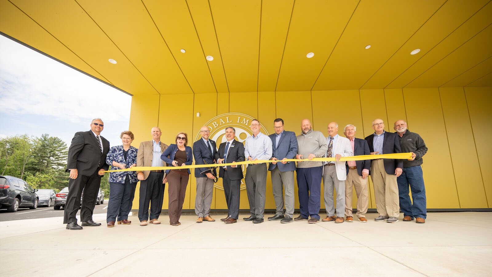 Representatives from Global Impact STEM Academy, Clark State, WSA Studio, MARKER construction, West Central Port Authority, New Carlisle Federal Savings Bank, and elected officials cut the ribbon for the new $16.9 million Upper Academy facility.