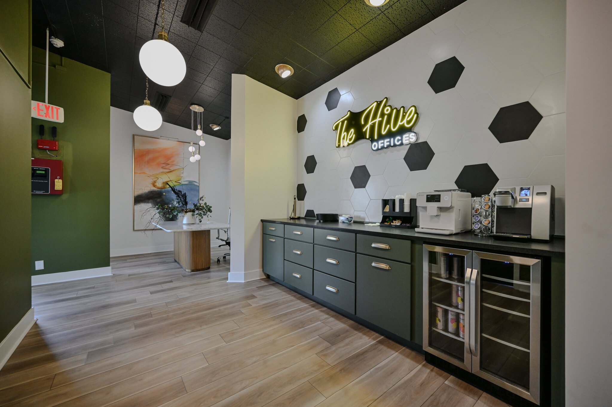 The Hive features a coffee bar, an espresso machine, snacks, and a drink fridge.