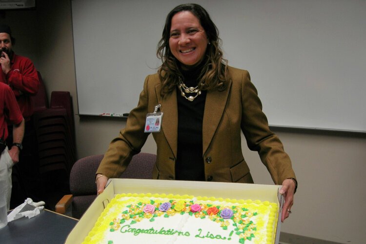 Lisa Titus and colleagues celebrate her promotion to Executive Director at River City Correctional Center in 2013.