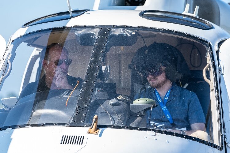 A helicopter gave rides to demonstrate the zero-visibility technology built into a specialized helmet.