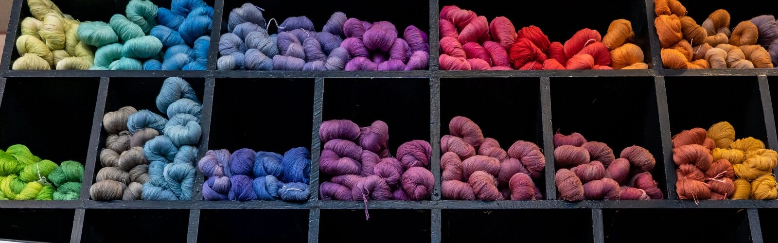 A wall of hand-dyed yarn at Alcony Weavers in Downtown Springfield.