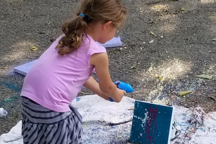 A recent $5 Art lesson included kids using paint-filled squirt guns to make designs on canvas.