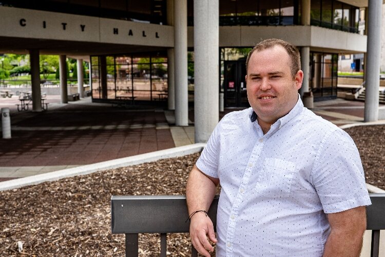 Bradley Minerd stands on City Hall Plaza, which will soon be filled with the annual Springfield Pride celebration.