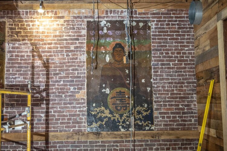 Artwork from decades ago was revealed behind layers of wall inside the Buckeye Lodge.