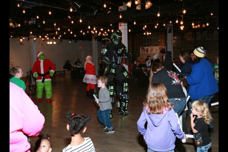 DJ Grinch and Ricky the Robot at the 2022 Christmas at the Bushnell.