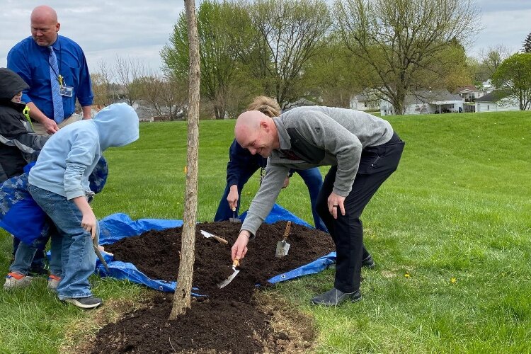The City of Springfield's Arbor Day event was held at Warder Park Wayne Elementary and concluded with City staff helping the kids plant a tree behind the school.