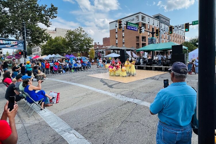 Crowds gathered to watch live musical and dance performances that filled the stage in the middle of Fountain Avenue and High Street.