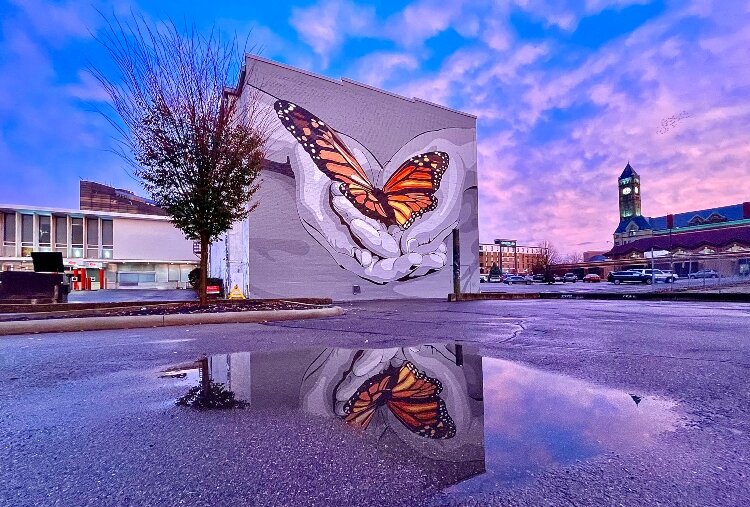 The mural on the back of the State Theater was completed during the filming of Finding Harmony.