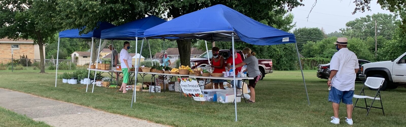 A farm stand coordinated by Springfield Ohio Urban Plantfolk (SOUP) sets up to sell fresh produce at Perrin Woods Elementary School.