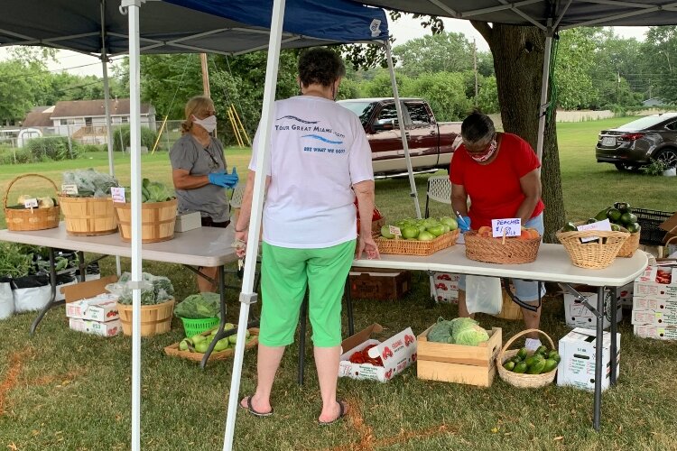 Organizers of the Springfield Ohio Urban Plantfolk group setup to sell fresh produce at their farm stand at Perrin Woods Elementary School.