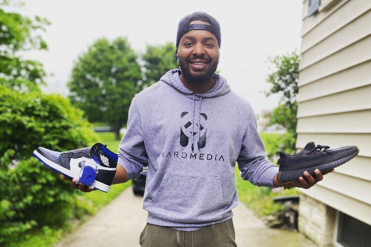 Derrick Humphrey, co-owner of HRD Apparel, shows off some of the products he offers in his new online store.