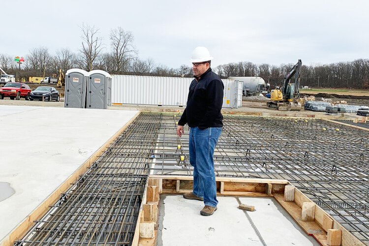 City of Springfield Chief Building Official Brandon Gill observes construction at the site of Gabe’s distribution center at the Prime Ohio II Industrial Park last year.