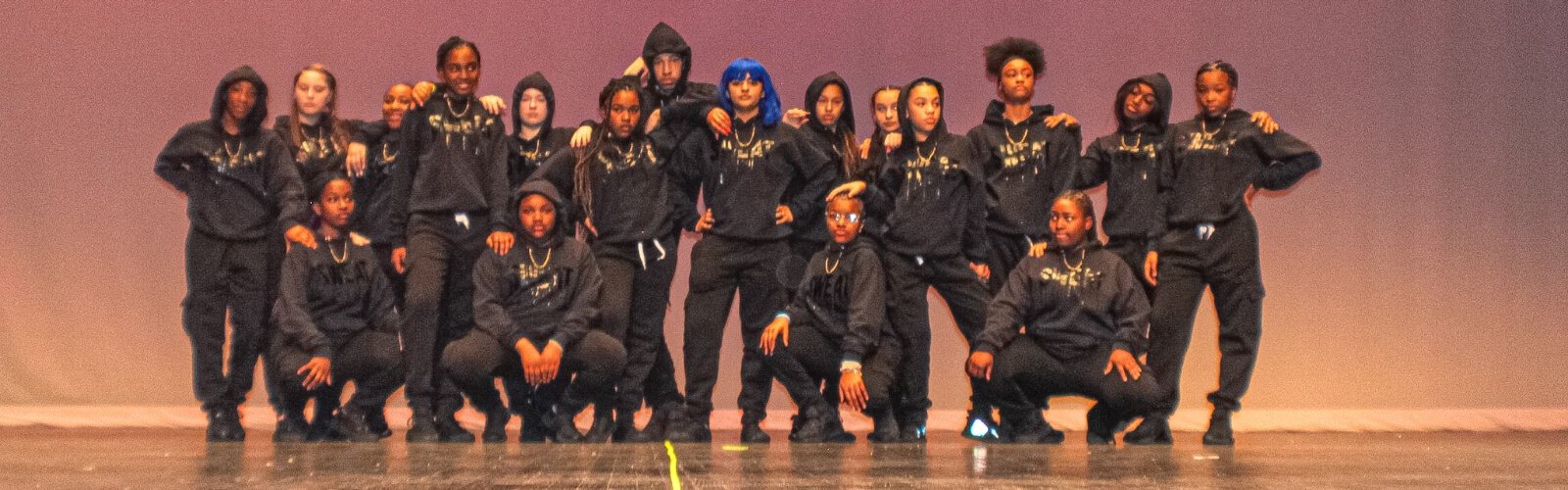 A dance team competing in the 2022 Dance, Stomp, Shake competition performance.