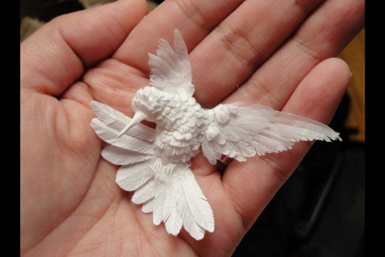 Cheong-ah Hwang specializes in intricate paper artwork, including pieces depicting hummingbirds.