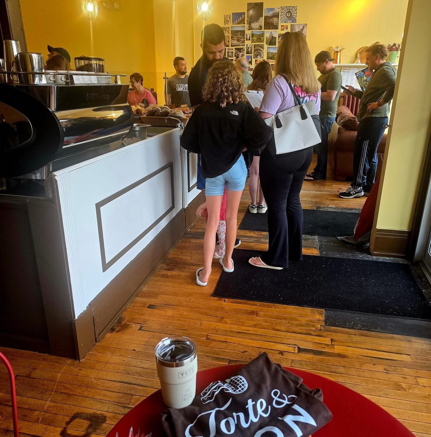 Customers waiting inside Torte & Iron Cafe.