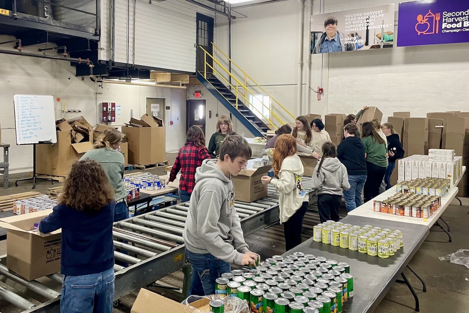 Twenty-three students dedicated their time to pack 200 boxes of food, contributing to the ongoing efforts of Second Harvest in fighting hunger.