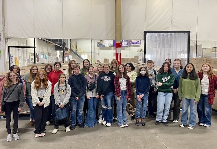 Twenty-three students dedicated their time to pack 200 boxes of food, contributing to the ongoing efforts of Second Harvest in fighting hunger.