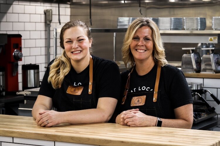 Marcy Nesselroade (right) owns Ironworks Waffle Cafe in COhatch The Market in Springfield and runs the business with her daughter Ellie Morgan (left).
