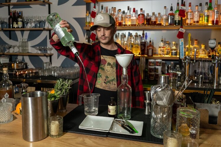Joel Shear serves as the lead bartender at The Market Bar, where he creates new menu items and some of the handmade cocktail syrups and flavorings.