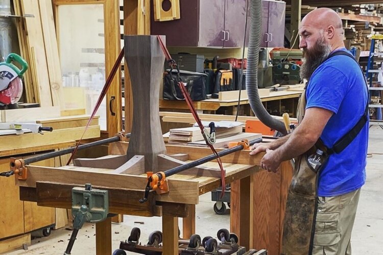 Mark Schultz, co-owner of Keener & Schultz Fine Woodworks, designs a custom piece in the workshop.