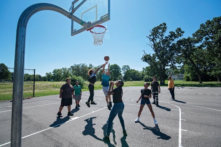 My Brother's Keeper participants play basketball at Davey Moore Park.