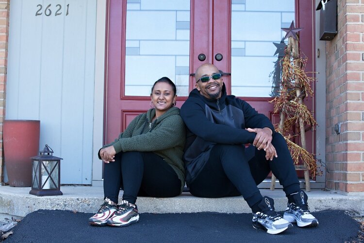 While some porch portraits were pre-planned, Vicki Rulli also stumbled upon couples like this one as she was walking Springfield neighborhoods taking other photos.