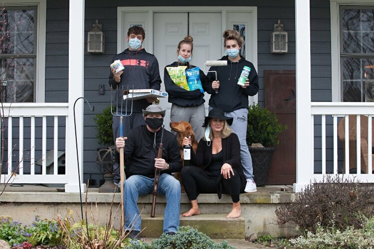The Lee family was prepared to showcase their own example of what they'll remember from the COVID-19 pandemic during their porch portrait.
