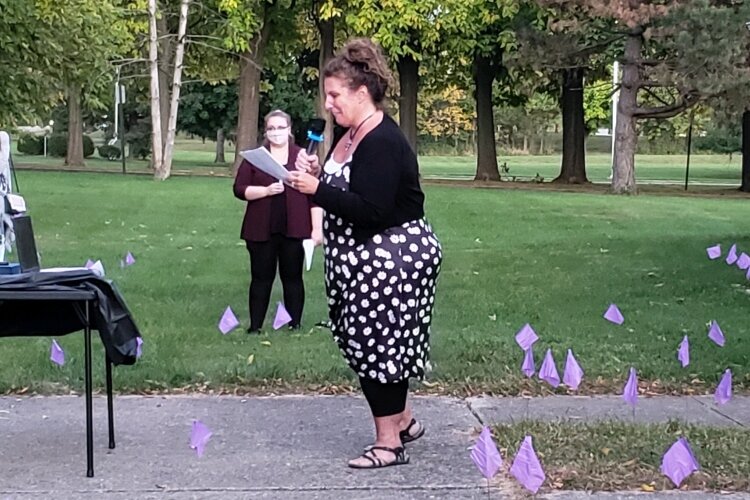 Project Woman Executive Director Laura Baxter spoke during a candlelight vigil Oct. 7 to show support for those people affected by domestic violence.