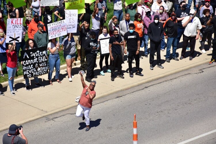 Springfield NAACP President Denise Williams addresses the crowd near the courthouses in Downtown Springfield on Sunday.