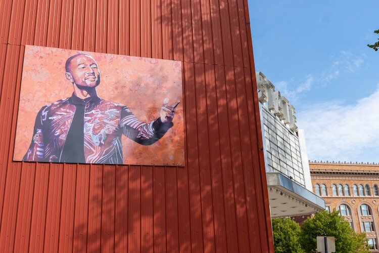 A new mural on the side of the State Theatre featuring Springfield's own John Legend.