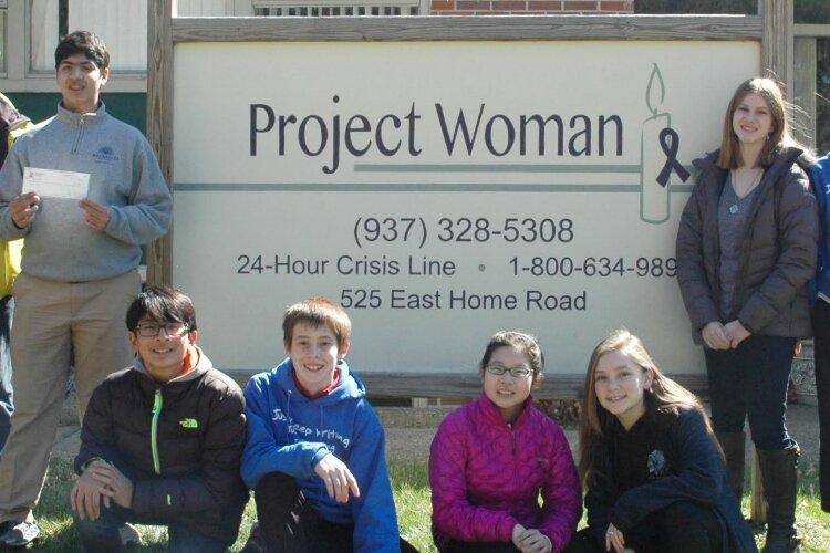 Students from Ridgewood School showcase one of their many donations to Project Woman.