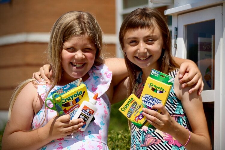 Sisters Juliana Rivera (left) and Maya Woerlein (right) are excited Springfield City School District will be providing their school supplies this year.
