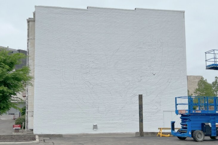 Outlines have been added for the new mural to be painted back wall of The State Theater.