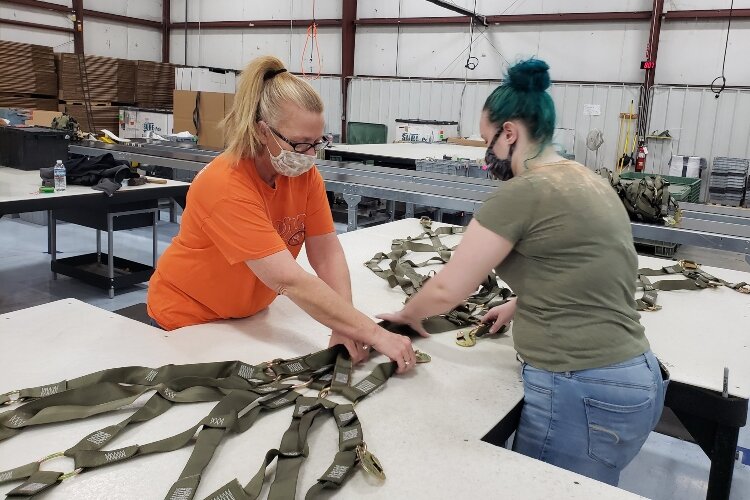 TAC employees work to manufacture nylon cargo nets that the U.S. Air Force uses to transport materials around the world.