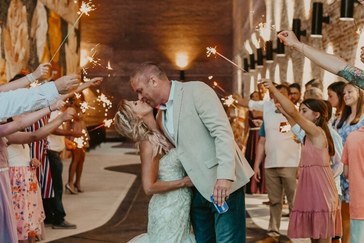 The Rose City Mural served as decoration itself for the wedding ceremony and photos for the Stotts' recent wedding in Downtown Springfield.