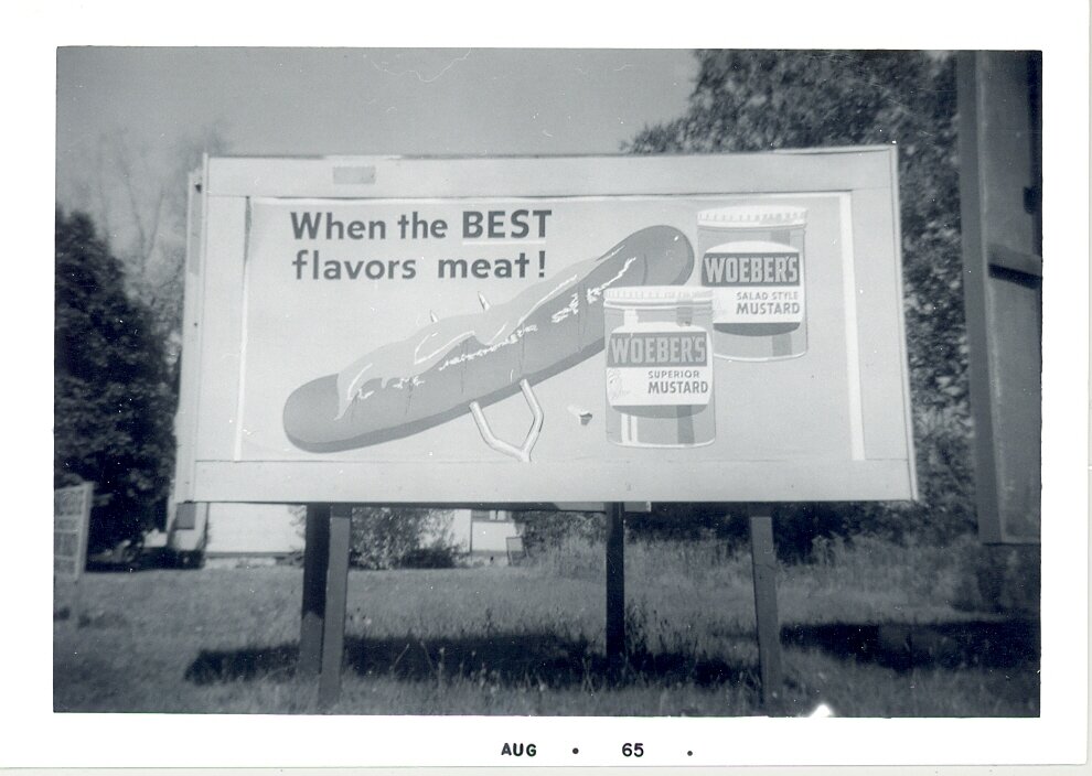 A Woeber Mustard Company billboard from 1965.