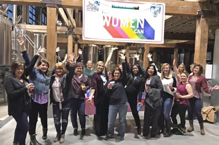 A group of women gathered to celebrate International Women's Day in 2019.