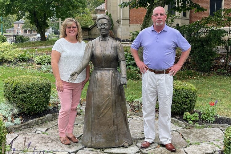 Ed and Kim Buchwalter stand with a statue of Clementine Buchwalter, a relative of Ed's who first started what is now known as the Woman's Town Club in Springfield.